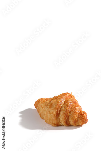 Croissant isolated in wihite background with sunny light