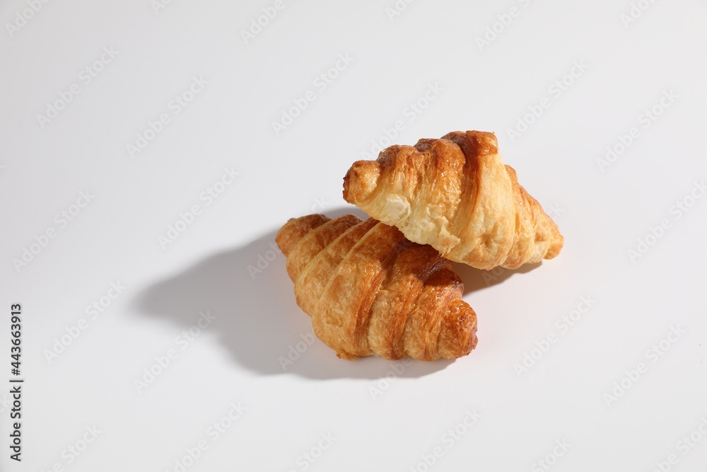 Croissant isolated in  wihite background with sunny light