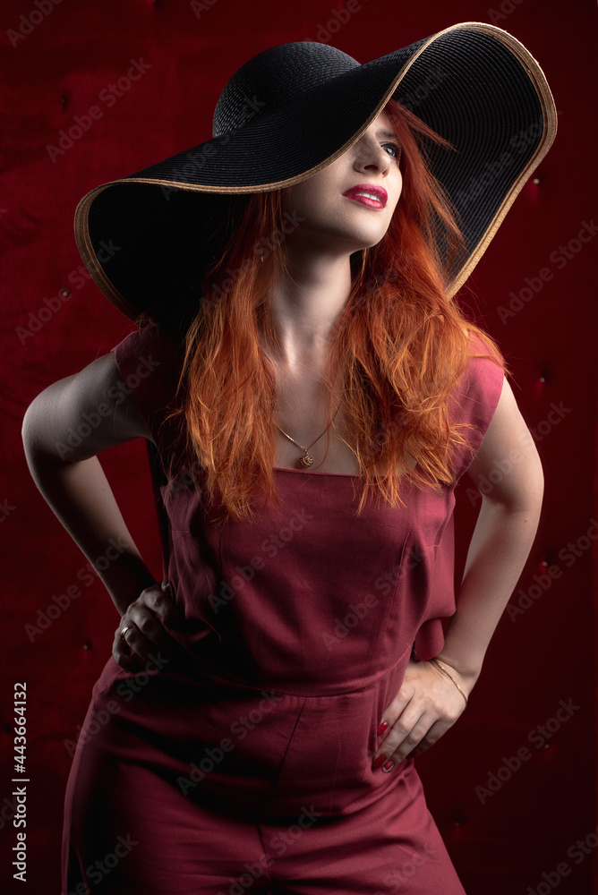 redhead woman, girl in a dark key, sexy and painted red lips redhead woman, girl in a dark key, sexy and painted red lips