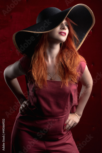 redhead woman, girl in a dark key, sexy and painted red lips