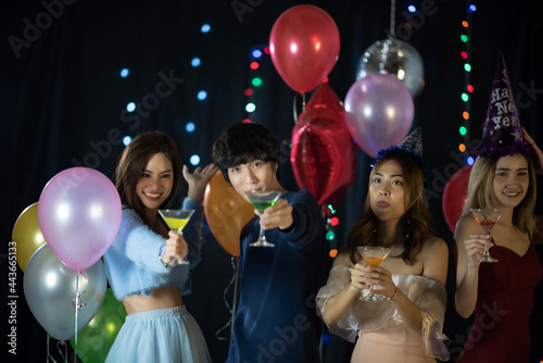 portrait of young people having happiness fun with friendship in new year tradition, smiling with alcohol in birthday party to joy with event in nightclub