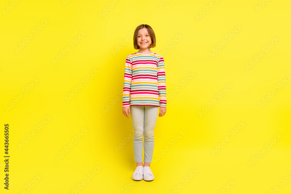 Full body photo of charming happy attractive girl good mood smile cute isolated on shine yellow color background Full body photo of charming happy attractive girl good mood smile cute isolated on shine yellow color background