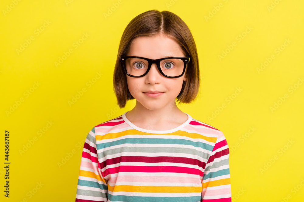 Photo of adorable young cute small girl wear glasses charming face smart isolated on yellow color background