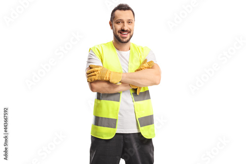 Smiling man waste collector in a uniform and gloves photo