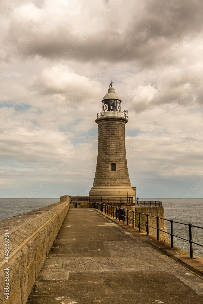 The Lighthouse at the end of the North Pier in Tynemouth, England, on a cloudy day