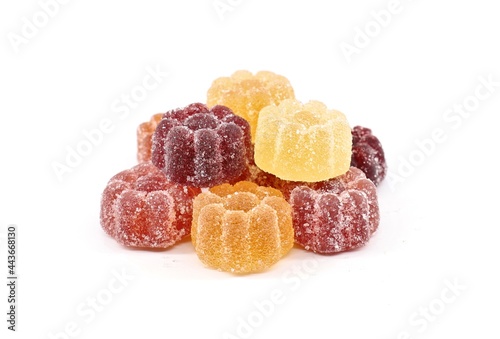 Jelly candies of various fruits flavor coated with sugar, on white background photo