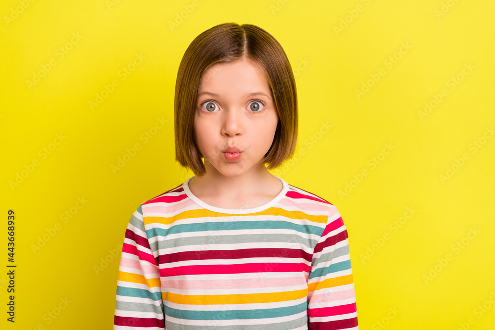 Photo of funny funky charming small girl send air kiss good mood isolated on shine yellow color background Photo of funny funky charming small girl send air kiss good mood isolated on shine yellow color background