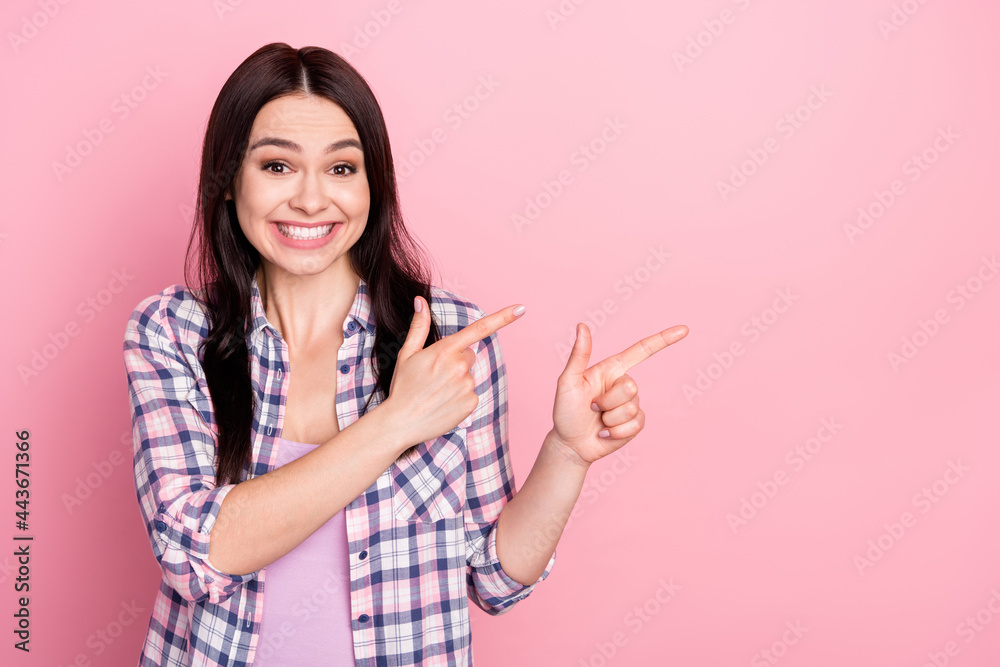 Portrait of pretty cute cheerful girl showing copy empty space ad isolated over pink pastel color background Portrait of pretty cute cheerful girl showing copy empty space ad isolated over pink pastel color background