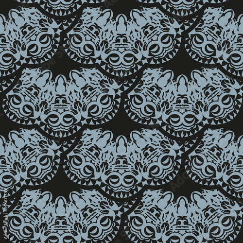 Dark dewy seamless pattern with blue vintage ornaments. Wallpaper in a vintage style template. Indian floral element. Ornament for wallpaper, fabric, packaging and paper.