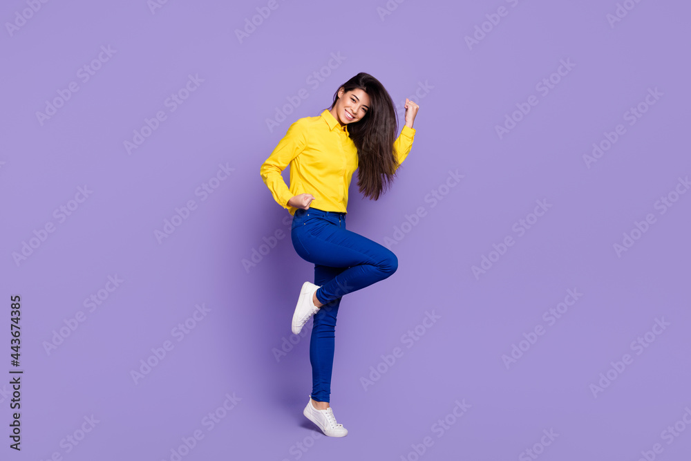 Full length photo of charming nice young woman winner luck celebrate smile isolated on purple color background Full length photo of charming nice young woman winner luck celebrate smile isolated on purple color background