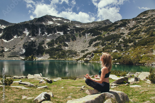 Portrait of a woman who meditates in the mountains