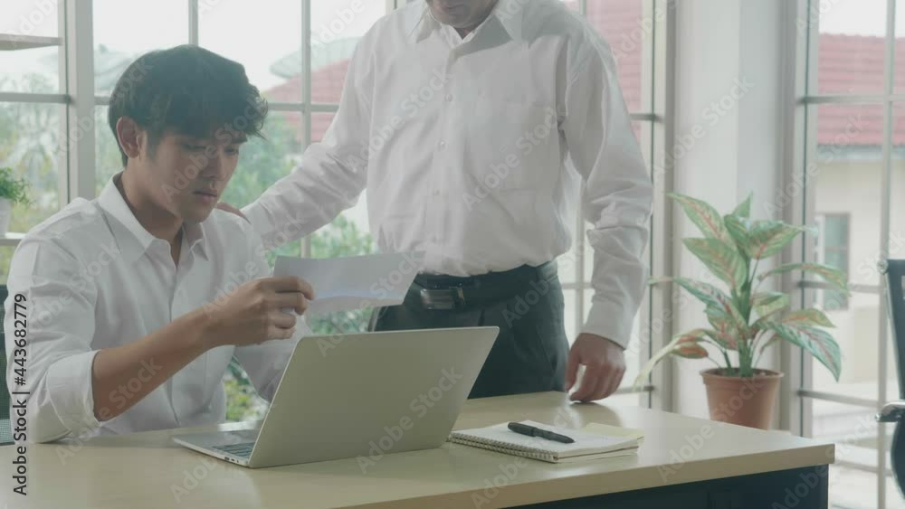 Manager giving notification dismissal with employee for letter on desk at office, businessman expression sad and depressed after reading letter fired, unhappy and worried, business concept. Manager giving notification dismissal with employee for letter on desk at office, businessman expression sad and depressed after reading letter fired, unhappy and worried, business concept.