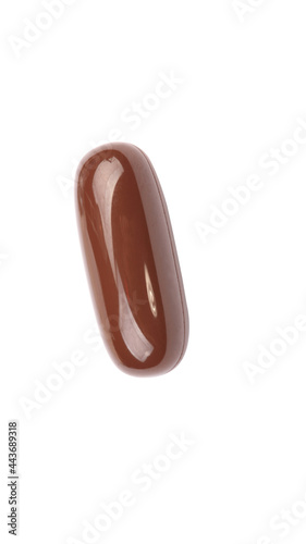 Obraz na plátne one brown gelatine pill isolated on white backgroung