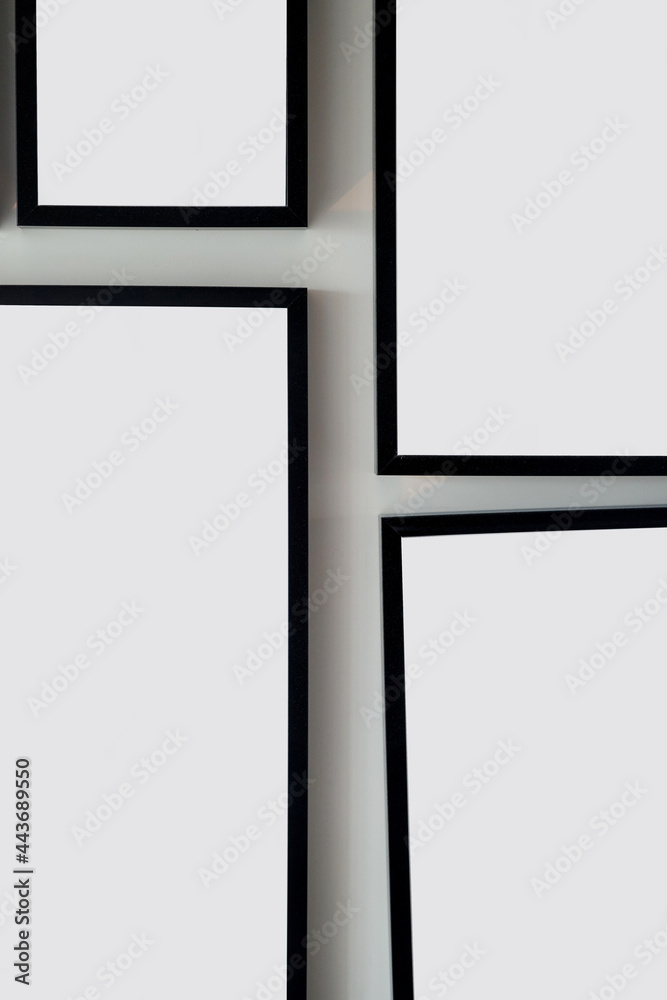 Different size framed photos hanging on the gray wall. Mockup. Different size framed photos hanging on the gray wall. Mockup.