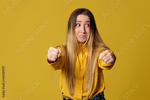 Φωτογραφία blonde girl pretending to ride a car
