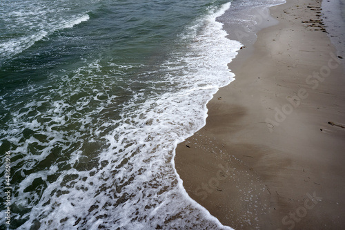 Fototapeta Naklejka Na Ścianę i Meble -  sand beach on the baltic sea with waves, spray and foam