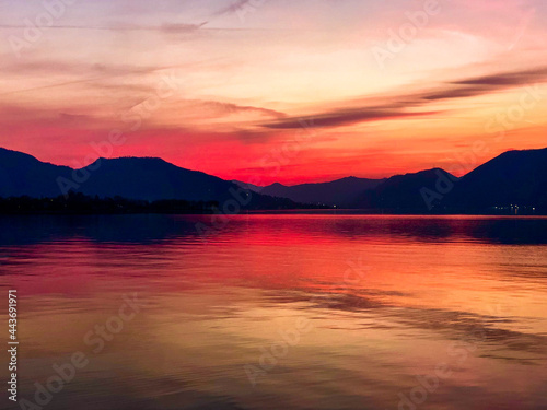 Beautiful view after sunset at lake with background mountains and reflections