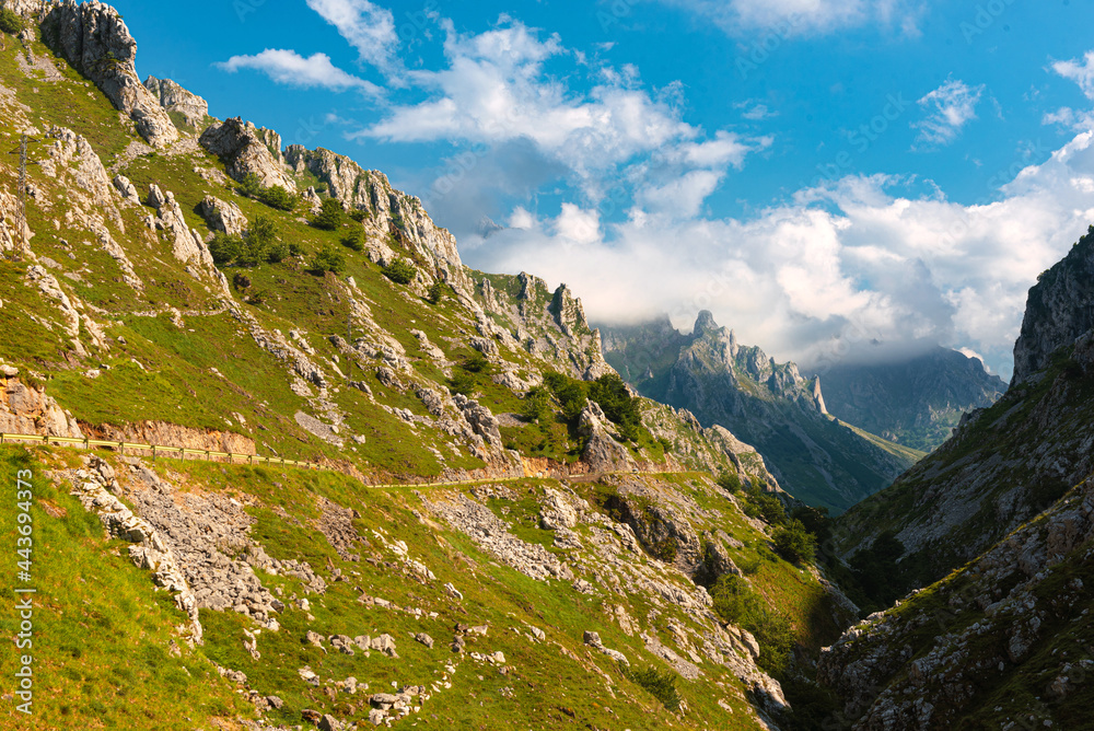 spectacular mountainous landscape with a road running through its gorge. Picos de Europa National Park, Asturias, Spain. spectacular mountainous landscape with a road running through its gorge. Picos de Europa National Park, Asturias, Spain.
