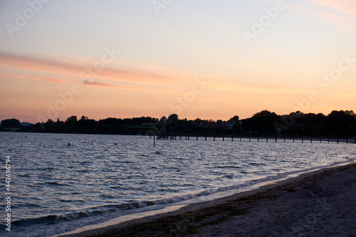 beautiful sunset on the white baltic sea beach © creativcontent