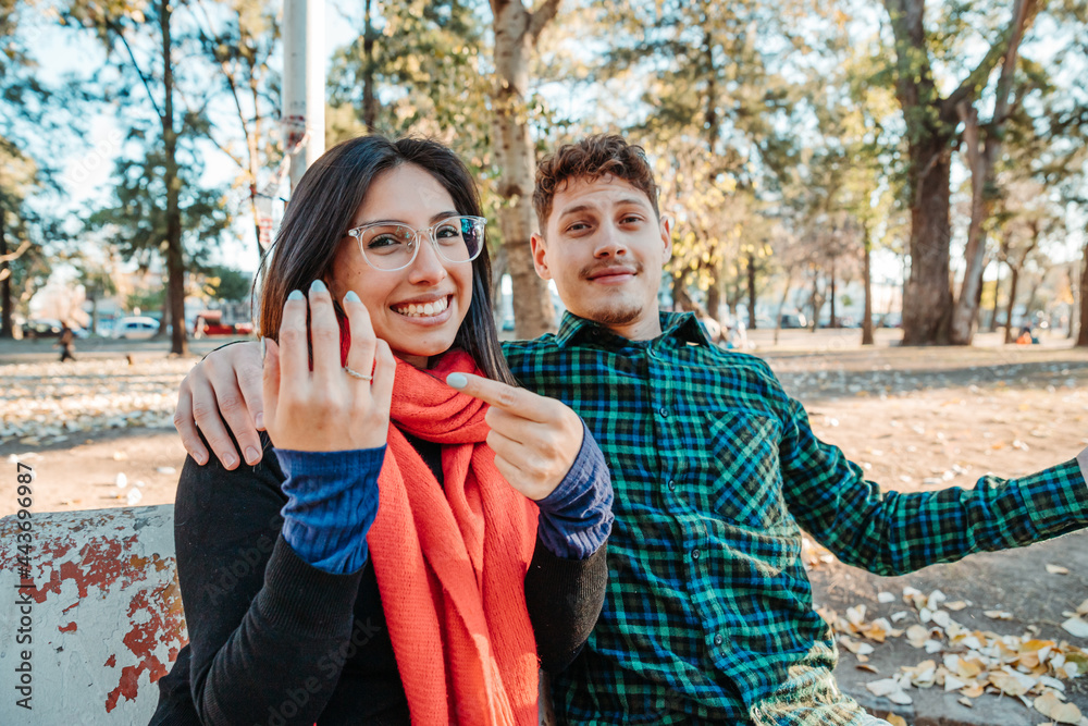Fototapeta premium marriage proposal in a park, a young couple
