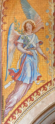 VIENNA, AUSTIRA - JUNI 24, 2021: The fresco of angel with the flower in the Votivkirche church by brothers Carl and Franz Jobst (sc. half of 19. cent.).