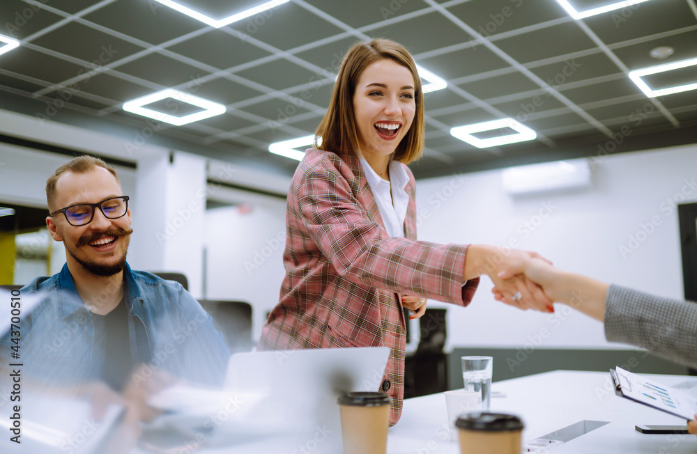 Fototapeta premium Successful team. Group of young businessmen working and communicating together in creative office. Brainstorming concept. Planning, education, analysis, collaborate work in teamwork.