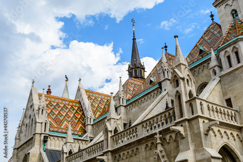 Details of the Matthias Church (Mátyás Templom) that is a Roman Catholic church located in Budapest, Hungary, in front of the Fisherman's Bastion at the heart of Buda's Castle District, in a sunny day