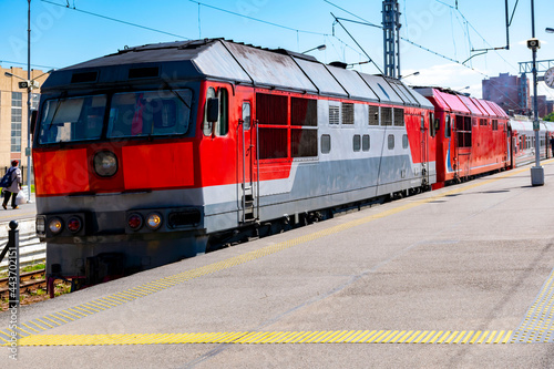 Railway platform - diesel locomotive, electric train.