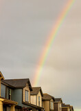 Rainbow over the row of new houses after a thunderstorm in Denver, Colorado