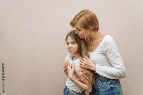 a young Caucasian happy mother with her daughter. portrait of a loving mother and daughter. taking care of my daughter. the concept of a happy motherhood and childhood