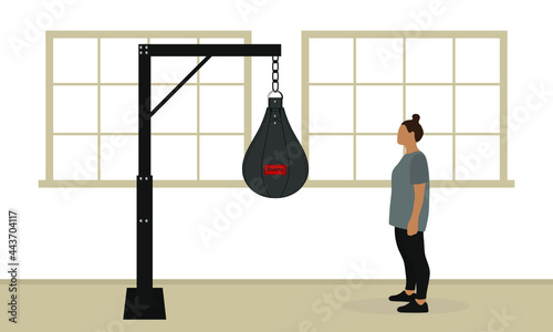 Female character in sportswear stands in front of a punching bag in the gym