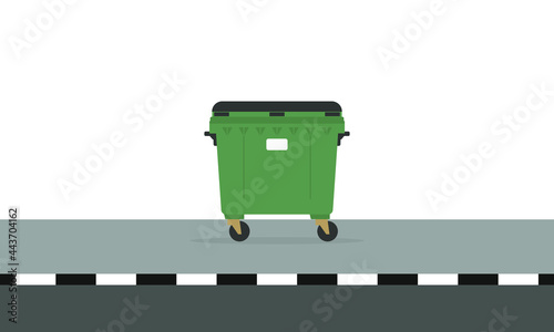 Garbage container stands on the sidewalk on a white background