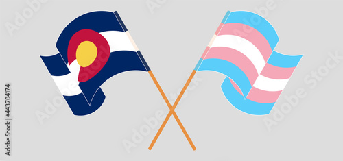 Crossed and waving flags of The State of Colorado and Transgender Pride