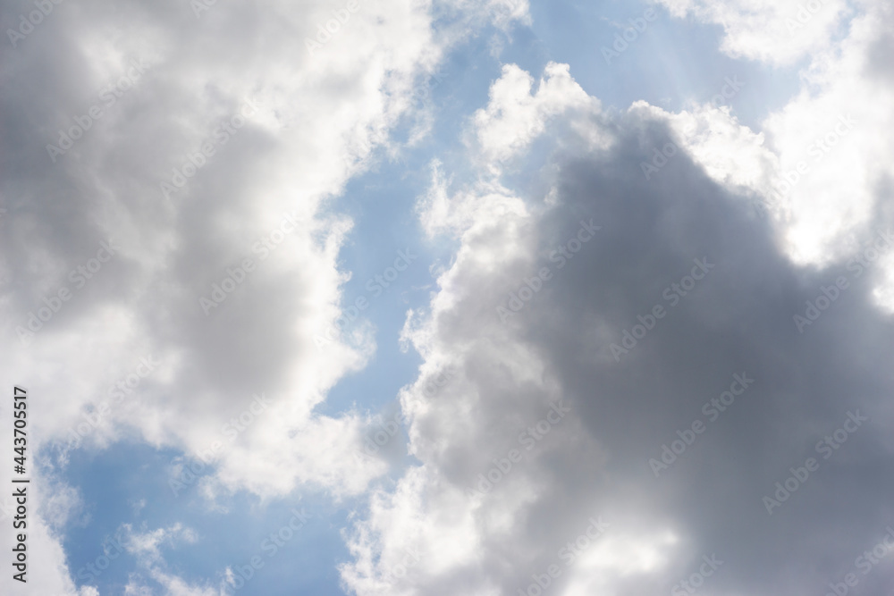 Scattered cloud clusters in a blue sky, blue sky background with white clouds,