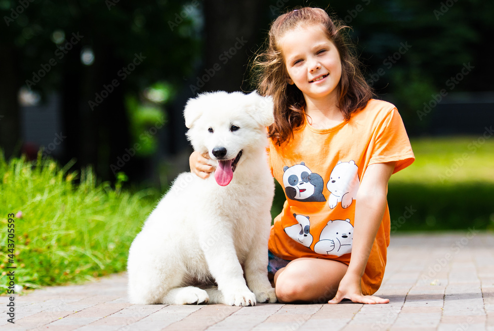 child girl and puppy for a walk child girl and puppy for a walk