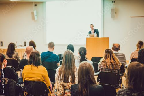 Audience in lecture hall on scientific conference.