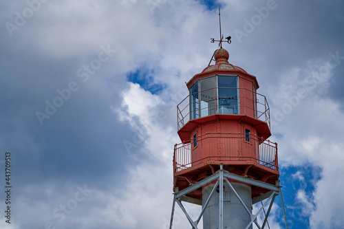 Lighthouse Under a Deep Blue Sky. photo