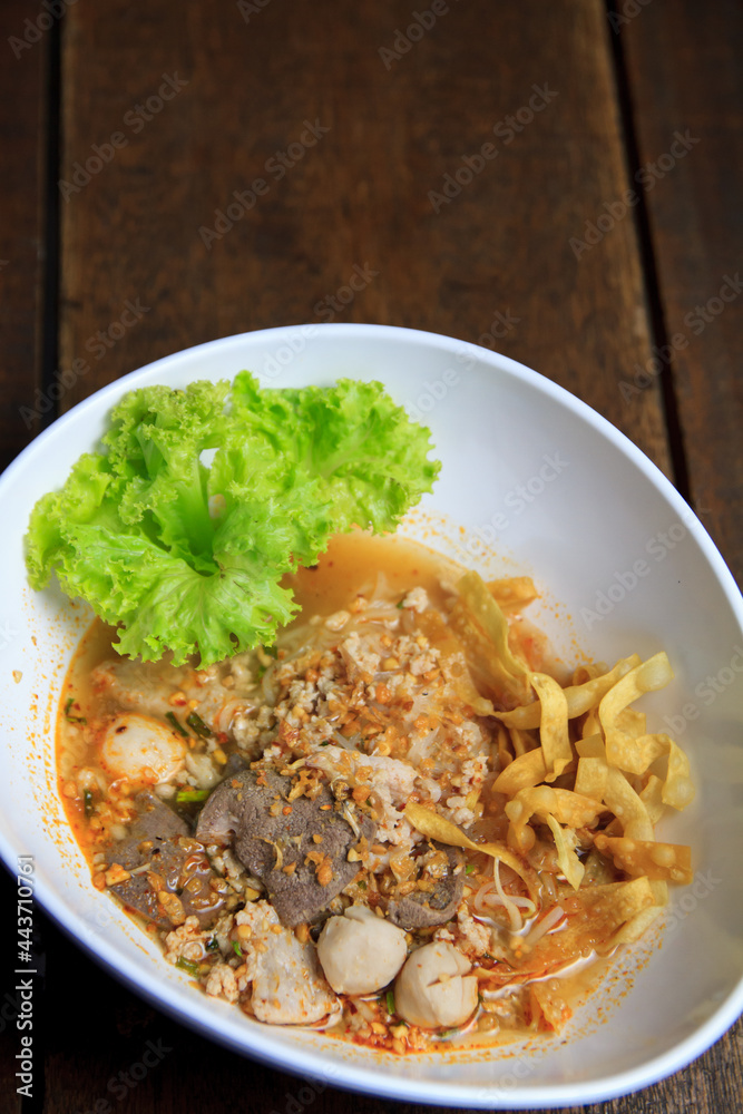 Thai food Spicy TOM YAM pork noodle soup with lemongrass, chilly pasted and lime juice Thai food Spicy TOM YAM pork noodle soup with lemongrass, chilly pasted and lime juice