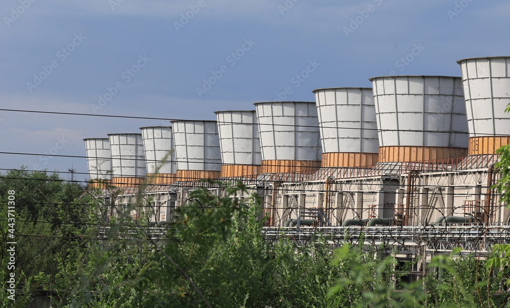 Obraz premium coolers from industrial chimneys on the landscape