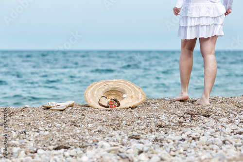 Girl in white dress resing at seashore photo