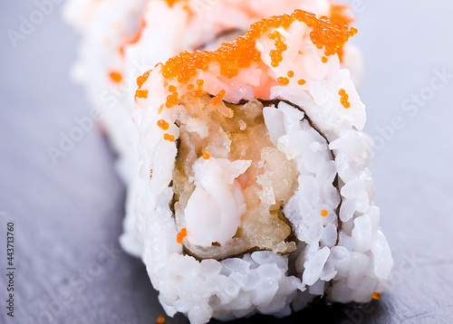 homemade sushi with baked prawn sprinkled with caviar photo