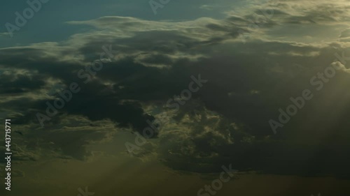 The clouds in the sky move beautifully and softly, shot with Time Lapse in a tall building. The view is slightly tilted up against the clouds.
