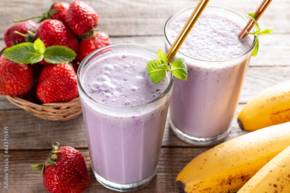 Fresh healthy strawberry smoothie on wooden background Fresh healthy strawberry smoothie on wooden background