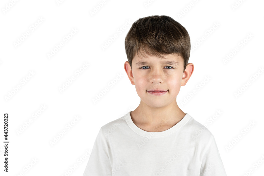 Little preschool boy in a light T-shirt on a white background, isolated. The boy has a serious face, he is waiting for his mother to return from work Little preschool boy in a light T-shirt on a white background, isolated. The boy has a serious face, he is waiting for his mother to return from work