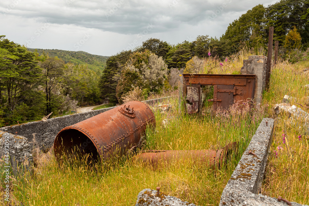 Remains in the landscape of an old mining factory in the ghost town of Waiuta, New Zealand Remains in the landscape of an old mining factory in the ghost town of Waiuta, New Zealand