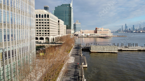 Aerial of downtown Jersey City across from the NYC skyline on the Hudson River.