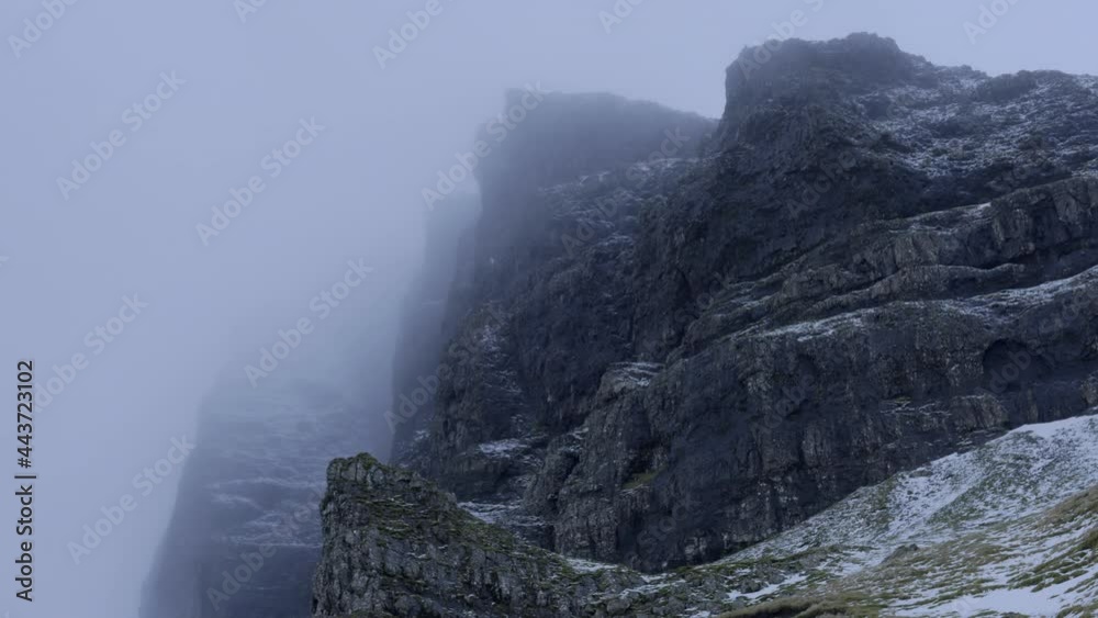 Isle of Skye, Scotland, UK, Old Man of Storr, at Sunrise Sunset, Ancient Natural Stone Monument with a touch of winter snow Isle of Skye, Scotland, UK, Old Man of Storr, at Sunrise Sunset, Ancient Natural Stone Monument with a touch of winter snow