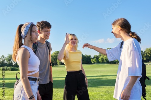 Meeting of teenage friends. Group of cheerful happy teenagers