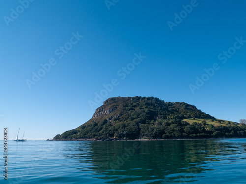 Landmark Mount Maunganui rising our of calm sea