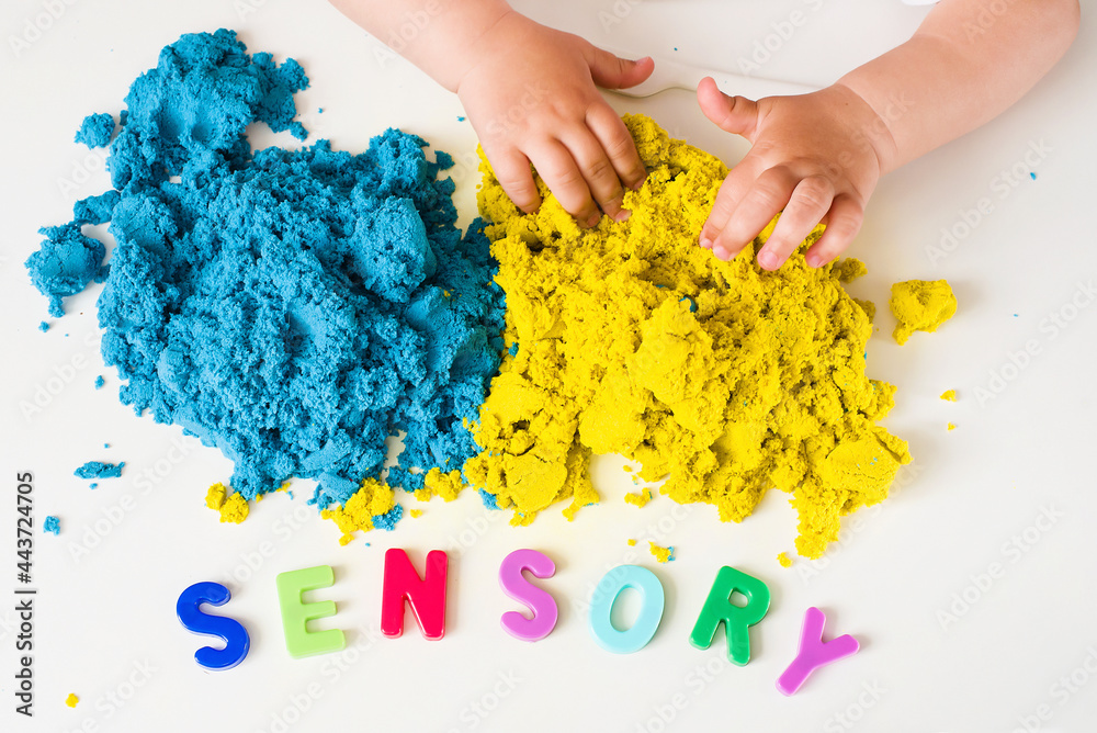 Sensory word and magic kinetic sand. Early sensory education. Kidd's sensory experiences, games and play for fine motor skills. Therapy hand, development of fine motor, autism, occupational therapy